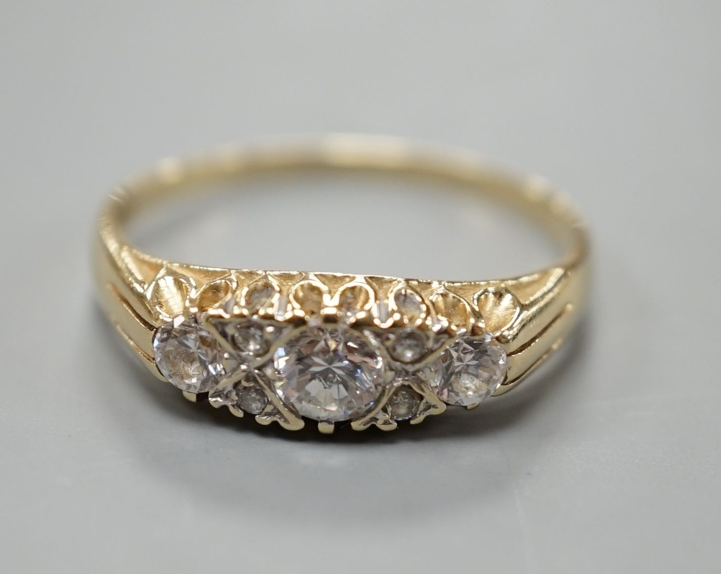 An 14ct gold and diamond dress ring, size T, gross 3.2 grams